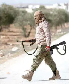  ?? — Reuters ?? Turkey-backed Free Syrian Army fighter is seen at Al Ajami village in east Al Bab, Syria, on Sunday.