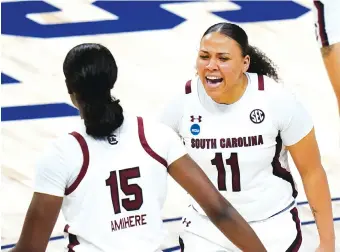  ?? AP PHOTO/ERIC GAY ?? South Carolina guard Destiny Littleton, right, celebrates with teammate Laeticia Amihere during the second half of Sunday’s Sweet 16 matchup against Georgia Tech at the Alamodome in San Antonio.