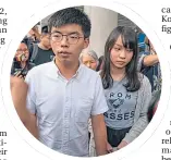  ??  ?? Joshua Wong and Agnes Chow leave court on Friday