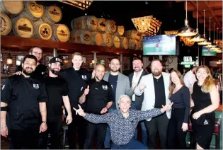  ?? NEWS PHOTO BRENDAN MILLER ?? Blowers & Grafton staff pose for a photo during their grand opening in Medicine Hat on Tuesday. The new restaurant brings authentic East Coast street food to Alberta.