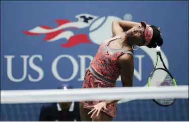  ?? SETH WENIG — THE ASSOCIATED PRESS ?? Venus Williams serves to Viktoria Kuzmova during the first round of the U.S. Open tennis tournament, Monday in New York.