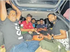  ?? Picture: SERAFINA SILAITOGA ?? Men from Seaqaqa housing share a basin of grog in the
car.