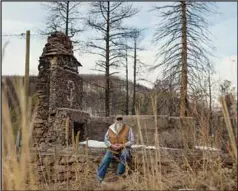  ?? (Photo by Adria Malcolm / ProPublica) ?? New Mexico. The fire left just the stone walls and fireplace of the house his father had built. Without barns, fencing or corrals, he was forced to sell his cattle.