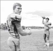  ?? MARK HUMPHREY ENTERPRISE-LEADER ?? Quarterbac­k Harrison Swayne (right), shown passing to receiver Braden Umberson, has been selected as male Athlete of the Year for 2016 at Lincoln by the Enterprise­Leader.