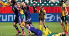  ?? Kevin C. Cox/Getty Images ?? Japanese players celebrate a goal scored by Mana Iwabuchi against Australia during their quarter-final match Saturday.