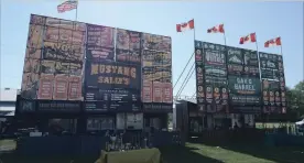  ?? DAVE JOHNSON THE WELLAND TRIBUNE ?? Mustang Sally's and Oak & Barrel are two of the vendors selling ribs, chicken, pulled pork and more at the fourth annual Welland Rib and Craft Beer Fest at Niagara Regional Exhibition Grounds this weekend.