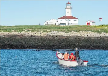  ??  ?? Visitors head to Machias Seal Island, located in the lower Bay of Fundy, approximat­ely 15 kilometres west of Grand Manan Island. Sovereignt­y of the island is disputed, with both Canada and the United States claiming ownership.