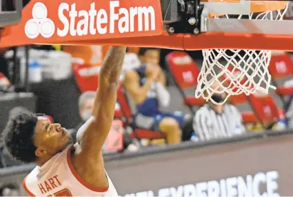  ?? KIM HAIRSTON/BALTIMORE SUN ?? Maryland’s Hakim Hart scores two of his 33 points in the second half against Saint Peter’s at the Xfinity Center on Friday.