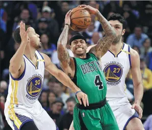  ?? BEN MARGOT / AP ?? Boston Celtics’ Isaiah Thomas squeezes between Golden State defenders Stephen Curry (left) and Zaza Pachulia on Wednesday night in Oakland, California. Thomas scored 25 points as the Celtics beat the sloppy Warriors 99-86.