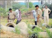  ?? PTI PHOTO ?? Police inspect the scene of crime with the accused, in Rohtak on Sunday.