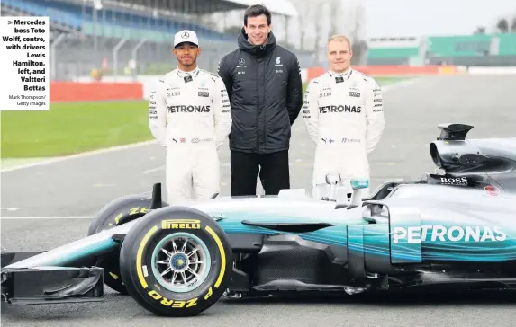  ?? Mark Thompson/
Getty Images ?? Mercedes boss Toto Wolff, centre, with driversLew­is Hamilton, left, and Valtteri Bottas