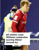  ??  ?? All smiles: Liam Williams celebrates scoring Wales’ second try