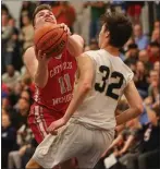  ?? PHOTO BY REBA SALDANHA — BOSTON HERALD ?? Catholic Memorial’s Matthew
St. Martin drives into Needham’s Campbell Keyes during CM’s 69-63 boys basketball victory Thursday.