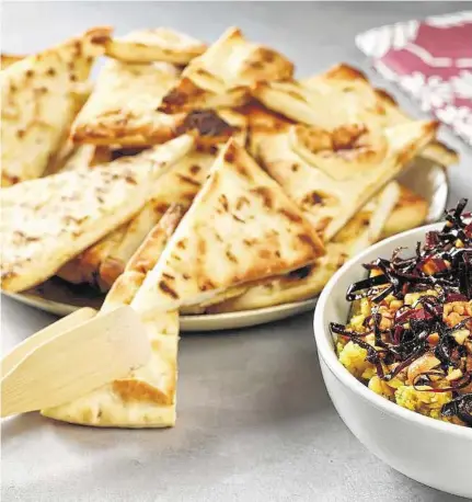  ??  ?? Crispy Naan Wedges are the perfect companions for Red Lentil and Peanut Dip.