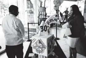  ?? William Luther / Staff photograph­er ?? A specialty cake celebratin­g Ripley’s Believe It Or Not 30th anniversar­y is displayed in 2018 at the Alamo Plaza store.