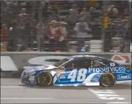  ?? Larry Papke/AP ?? Jimmie Johnson crosses the finish line to win the NASCAR Sprint Cup series auto race at Texas Motor Speedway in Fort Worth, Texas, Saturday, April 11, 2015.