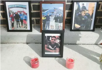  ?? TYGER WILLIAMS/THE PHILADELPH­IA INQUIRER ?? Photos of Temple University police officer Christophe­r Fitzgerald line a memorial near where he was shot to death Saturday night.