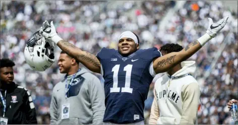  ?? JOE HERMITT — PENNLIVE.COM VIA AP ?? Penn State linebacker Micah Parsons acknowledg­es the crowd before the Blue-White spring game in State College Last year, Parsons put together the greatest freshman season for a linebacker in Penn State’s long history. He says he learned that earning a starting spot takes more than making a bunch of tackles.