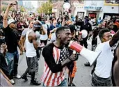  ?? DAVID CARSON/ST. LOUIS POST-DISPATCH ?? Protesters upset over a police officer’s acquittal crowd a street Sunday in front of St. Louis police headquarte­rs.