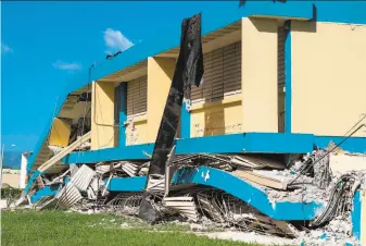  ?? Ricardo Arduengo/ AFP via Getty Images ?? A 6.4 magnitude earthquake collapsed portions of the threestory Agripina Seda school in the southern coastal city of Guanica on Jan. 7, two days before classes were scheduled to start.