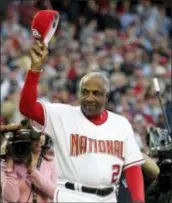  ?? EVAN VUCCI — THE ASSOCIATED PRESS FILE ?? Nationals manager Frank Robinson tips his hat to the crowd as he is introduced during the 2005 home opener in Washington.