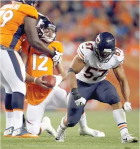  ?? DAVID ZALUBOWSKI/AP ?? Bears linebacker Kasim Edebali celebrates after sacking Broncos quarterbac­k Paxton Lynch (12) during the second half of a preseason game Aug. 18.