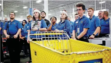  ?? [PHOTO BY LUKE SHARRETT, BLOOMBERG] ?? Employees gather for a meeting before opening the doors at a Best Buy store in Louisville, Kentucky.