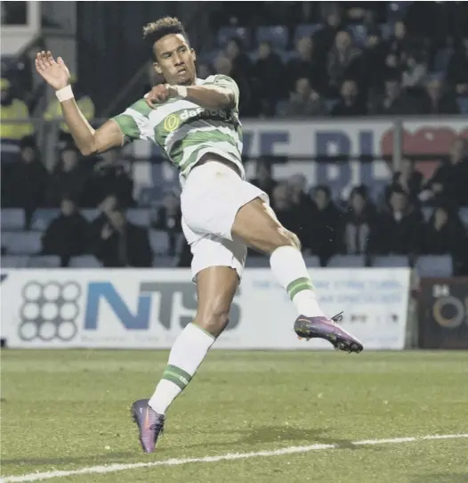  ??  ?? 0 Celtic substitute Scott Sinclair lashes a volley past Ross County goalkeeper Scott Fox to score his side’s third goal at the Global Energy Stadium and put a gloss on the scoreline which was later added to by Moussa Dembele.