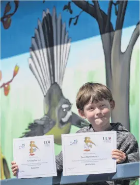  ?? PHOTO: GERARD O’BRIEN ?? Top marks . . . Maori Hill School pupil Torin Stephens with his distinctio­n certificat­es for gaining the top marks in the year 5 University of Canterbury Kiwi Competitio­ns for maths and science.