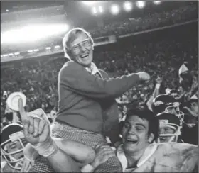  ??  ?? ESPN’s list of the 150 greatest college football coaches includes Lou Holtz (above), Frank Broyles (bottom left), Barry Switzer (bottom right) and 12 others with Arkansas ties. Holtz, who coached Arkansas from 1977-83, is carried by his players after defeating Oklahoma on Jan. 2, 1978, at the Orange Bowl in Miami. Broyles is seen coaching on the sidelines at the University of Arkansas in Fayettevil­le in this undated photo. Switzer is seen at an Arkansas practice on Nov. 17, 1965, with Jim Lindsey. (AP file photo - Holtz; Democrat-Gazette file photos - Broyles and Switzer)