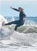  ?? PA. ?? Surfers at Long Sands beach in Tynemouth yesterday.