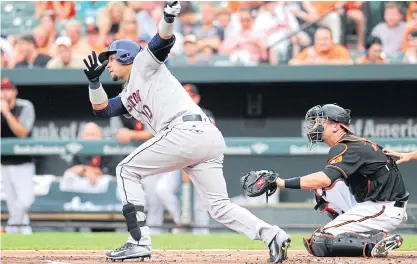  ??  ?? Astros first baseman Yuli Gurriel hits a home run in the first inning against the Orioles.