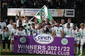  ?? Premiershi­p title. Photograph: Andrew Milligan/PA ?? ▲ The Celtic players celebrate after their 1-1 draw against Dundee United secured the Scottish