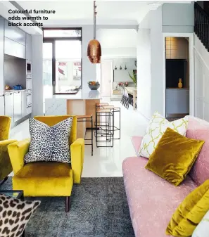  ??  ?? COLOURFUL FURNITURE ADDS WARMTH TO BLACK ACCENTS