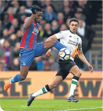  ??  ?? Wilfried Zaha shows good close control under pressure from Reds full-back Trent Alexander-arnold
MOHAMED SALAH’S