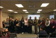  ?? LODI EDUCATION ASSOCIATIO­N PRESIDENT MICHELLE ORGON ?? Lawrence Elementary School Principal Juan Carlos Villafana, center, receives the California School Employee Associatio­n’s 2017 Boss of the Year Award at the Lodi Unified School District Board of Education’s meeting at the James Areida Education Support...