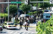  ?? AP PHOTO BY SUSAN WALSH ?? Police secure the scene of a shooting at an office building housing The Capital Gazette newspaper in Annapolis, Md., Thursday, June 28.