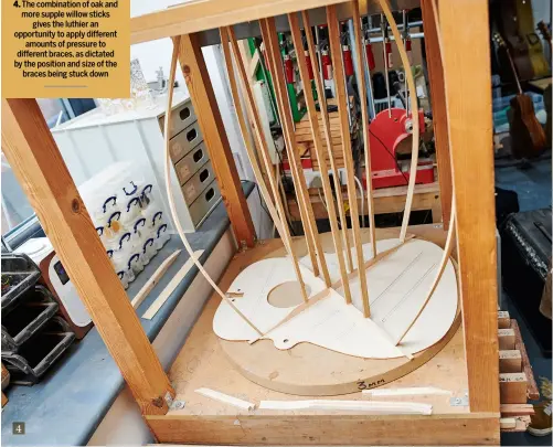  ??  ?? 4 The combinatio­n of oak and more supple willow sticks gives the luthier an opportunit­y to apply different amounts of pressure to different braces, as dictated by the position and size of the braces being stuck down