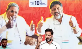  ?? PTI ?? GANDHI KI GUARANTEE. Congress leader Rahul Gandhi addresses an election campaign rally in support of the party’s candidate from Mandya constituen­cy, Venkataram­ane Gowda, ahead of the Lok Sabha elections, in Mandya district on Wednesday