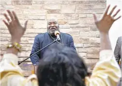  ?? ?? Bishop William E. McMillan, pastor of Rehoboth Ministries Church of God in Christ in the Parklane neighborho­od of northwest Baltimore, preaches on Palm Sunday.