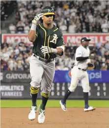  ?? Bill Kostroun / Associated Press ?? Khris Davis, who led the majors with 48 home runs, provided one of the A’s few highlights when he homered in the eighth.