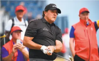  ?? Andy Buchanan/ AFP / Getty Images ?? Phil Mickelson, seen in a practice round Sunday, used experience to win the 2013 British Open.