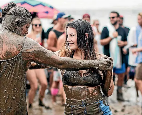  ?? LAWRENCE SMITH/ STUFF ?? Splore at Ta¯papakanga Regional Park is often turned into a mudbath but it doesn’t dampen the spirits of the festival-goers.
