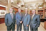  ?? [PHOTO BY STEVE GOOCH, THE OKLAHOMAN] ?? Standing in the lobby of BancFirst’s downtown Oklahoma City office are, from left, BancFirst Corp. Executive Chairman David Rainbolt; BancFirst Corp. CEO David Harlow; BancFirst CEO Darryl Schmidt; and Dennis Brand, chairman of BancFirst Corp.’s...