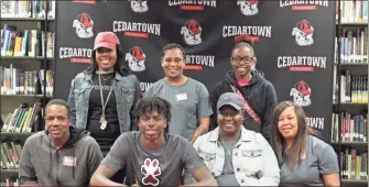  ?? / Kevin Myrick ?? Zah Frazier was joined by his family for his signing with Southern Illinois’ football program.