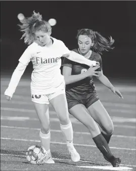  ?? BEA AHBECK/NEWS-SENTINEL ?? Lodi’s Kaylie Nies and Tokay’s Shayla Bradley fight for control of the ball during their game in Lodi on Tuesday.