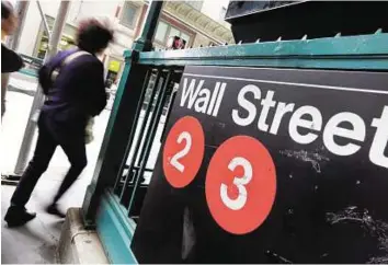  ?? AP ?? Plenty of room to run A Wall Street subway station in New York. The dollar is expected to strengthen further as the Federal Reserve moves towards raising rates for the first time in almost a decade.