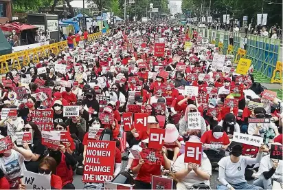  ?? — AFP ?? We’re watching you too: South Korean women staging a monthly protest against secretly filmed spycam pornograph­y in Seoul.