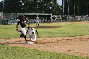  ?? Staff photo by Jason Hopkins ?? ■ Texarkana Twins shortstop Gunner Halter beats out an infield single to begin their game against Brazos City Bombers on Friday night at George Dobson Field in Texarkana, Texas. The Twins lost the season-opener, 6-4.