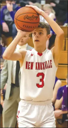  ?? Staff photo/ David Pence ?? New Knoxville’s Max Henschen attempts a 3- point field goal in front of the Fort Recovery bench during Friday’s Midwest Athletic Conference boys basketball game.